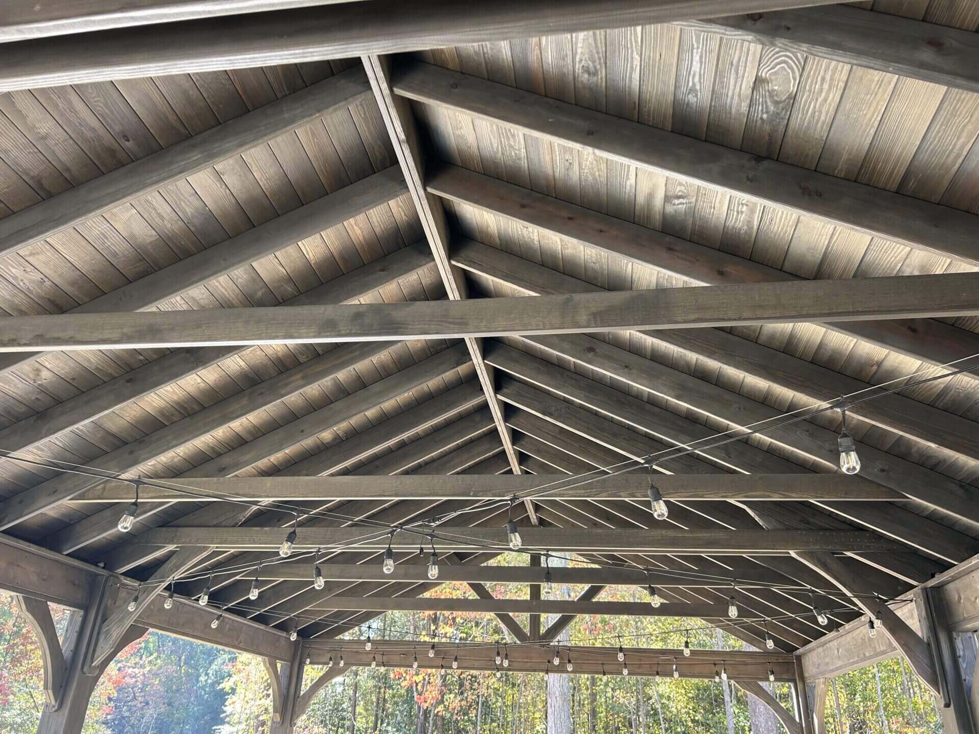 Wood pavilion ceiling with lighting for an outdoor living space