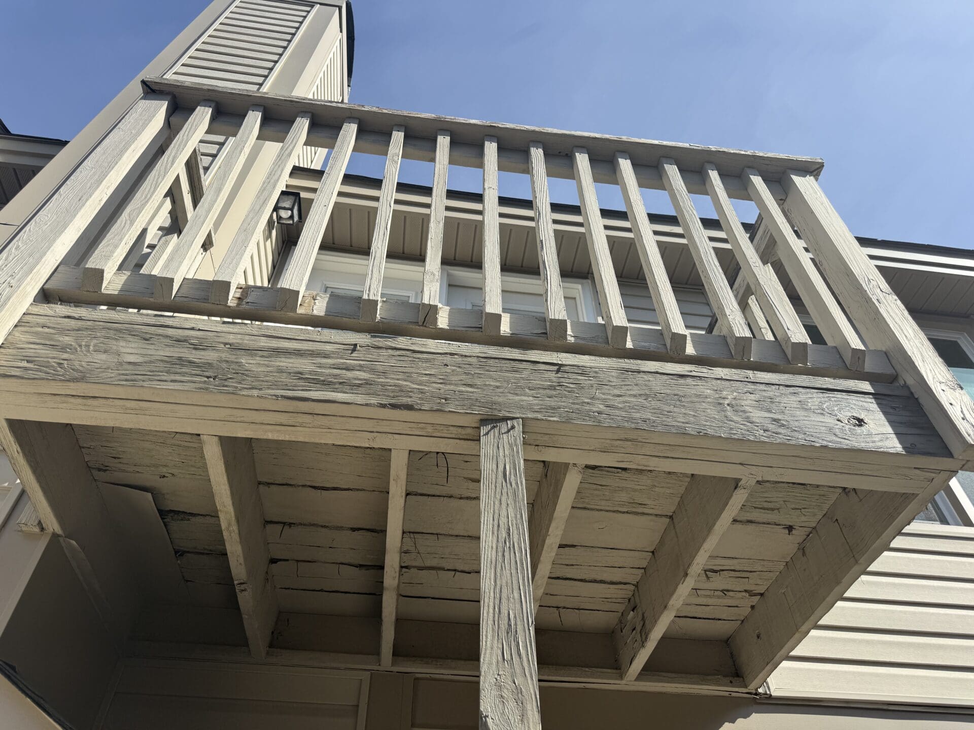 Waterfront-style composite deck with railing, built by B&B Decks