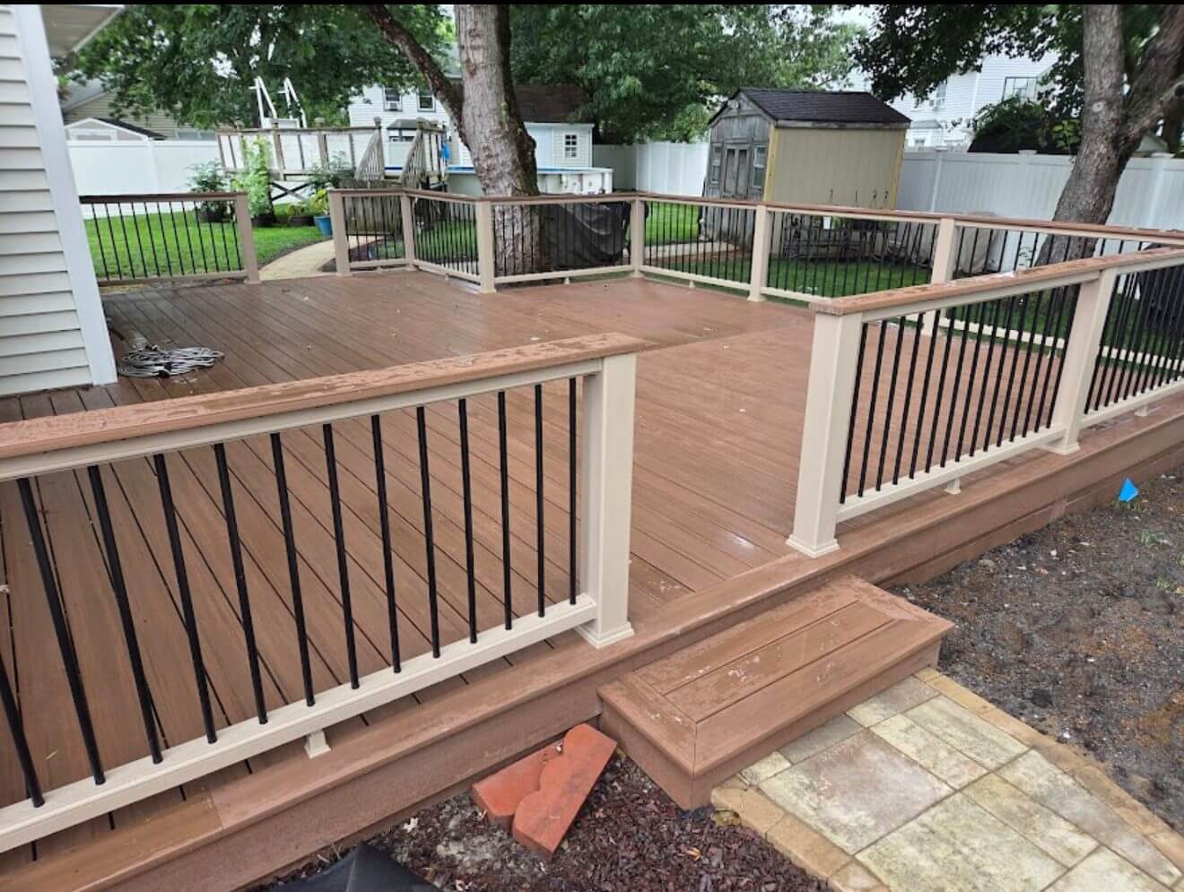 Finished multi-level capped-composite deck with railing built by B&B Decks