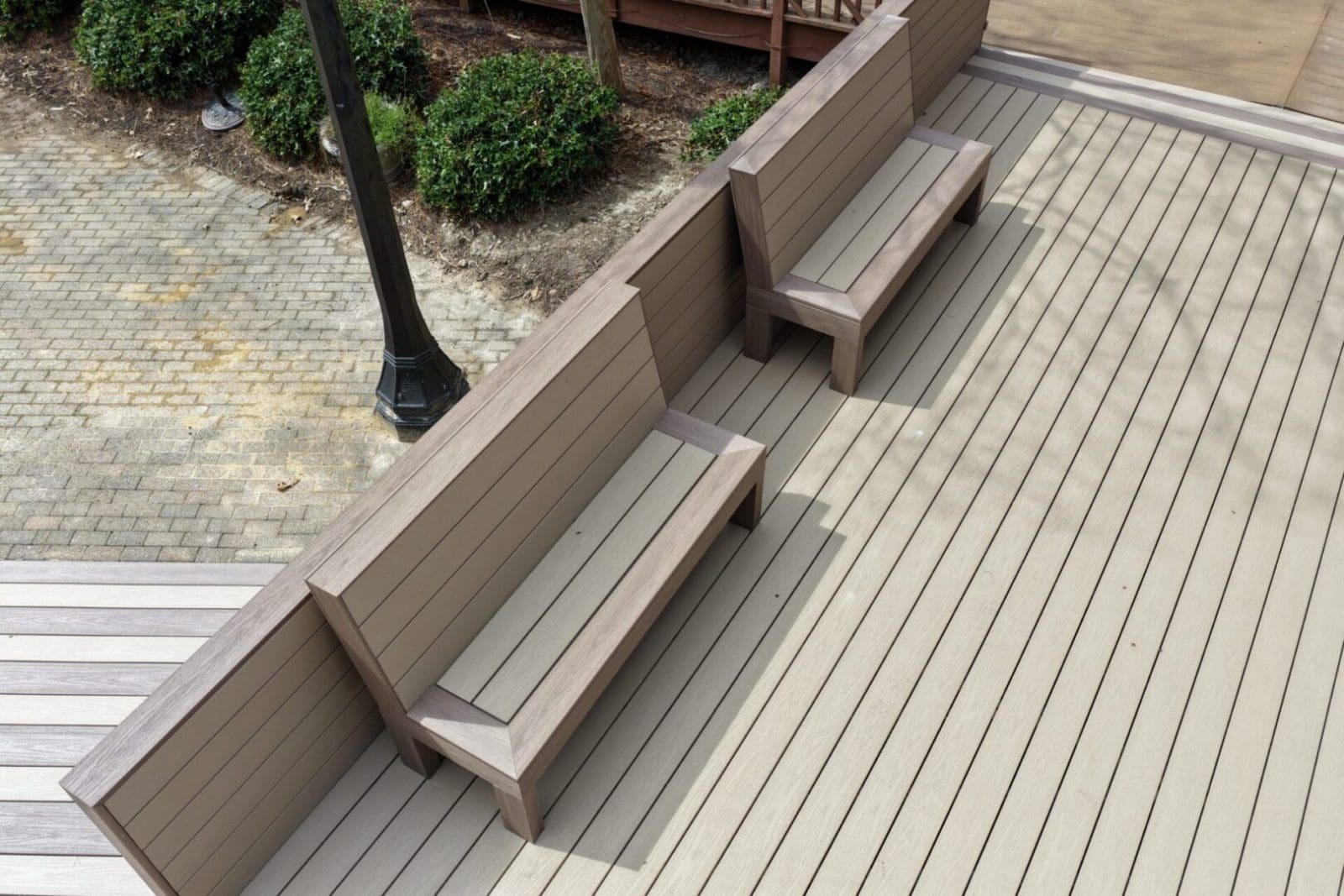 composite deck with built in benches by B&B Decks near Smithfield, VA