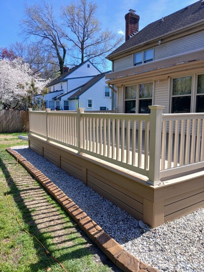 composite deck with tan railing by B&B Decks near Poquoson, VA