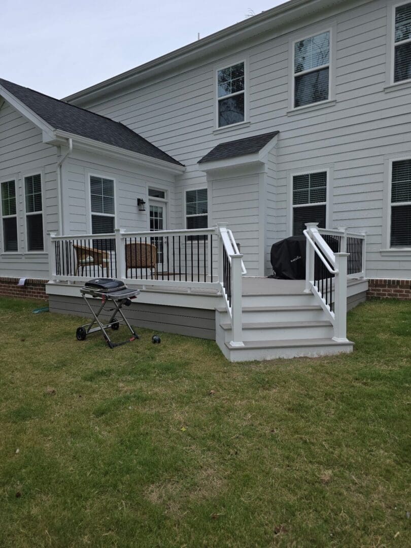 composite deck with white railing by B&B Decks near Smithfield, VA